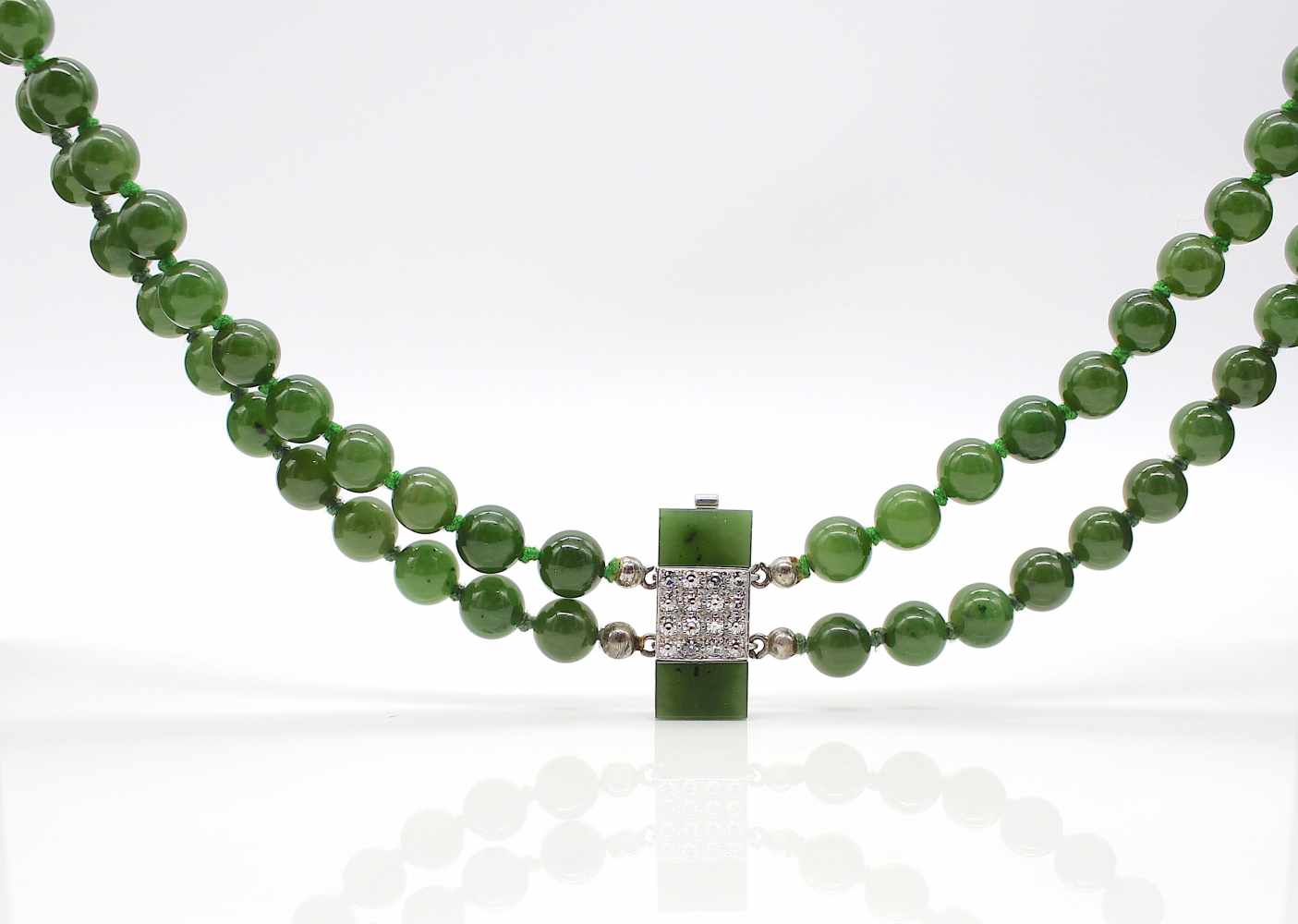 1 double-row necklace made of jade balls with a lock made of 585 white gold with jade and