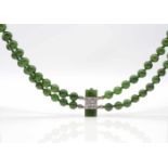 1 double-row necklace made of jade balls with a lock made of 585 white gold with jade and