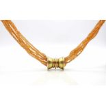 Necklace with 8 strands of mandarin garnet and a lock of 585 gold,weight 154,38 g ( lock approx.