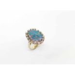 Ring in 585 white gold with an opal triplet and diamonds, total approx. 0.50 ct in medium quality.