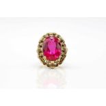 Ring of 585 gold with a synthetic ruby.Weight 8.6 g, size 54- - -15.00 % buyer's premium on the