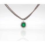 Pendant tested for 750 and a 750 white gold chain with an emerald, approx. 1.9 ct and 16 brilliant-