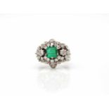 Ring tested for 750 gold with an emerald of approx. 1 ct and 41 diamonds, total approx. 1.1 ct (