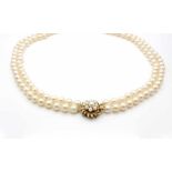 Akoya cultured pearl necklace in two rows, diameter 8 - 8.4 mm and a lock made of 10 kt gold.