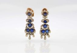 Pair of earrings tested for silver and 750 gold plugs with 10 sapphires, total approx. 5.5 ct and 74