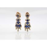 Pair of earrings tested for silver and 750 gold plugs with 10 sapphires, total approx. 5.5 ct and 74