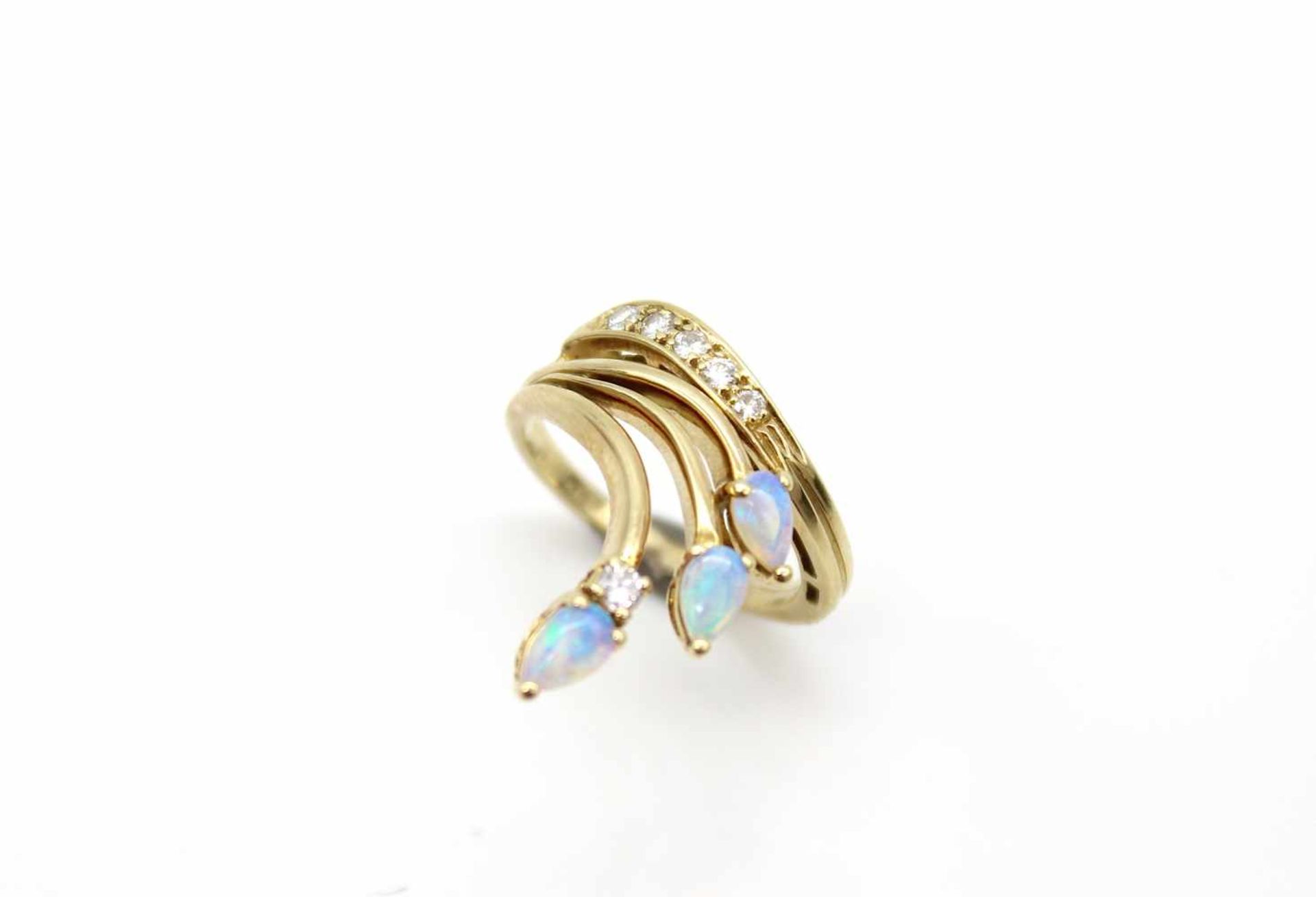 Ring made of 585 gold with 3 precious opals and 6 diamonds, total approx. 0.20 ct in high to