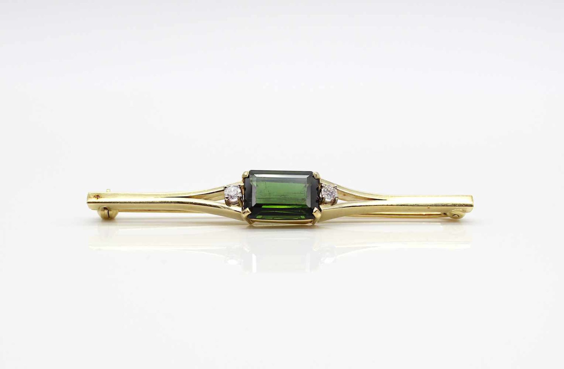 Needle made of 585 gold with a tourmaline approx. 4 ct and 2 diamonds each 0.07 ct,Weight 7.2 g,