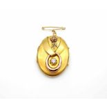 Medallion tested on 750 gold with a diamond approx. 0.45 ct, medium purity and colorWeight 10.6 g,