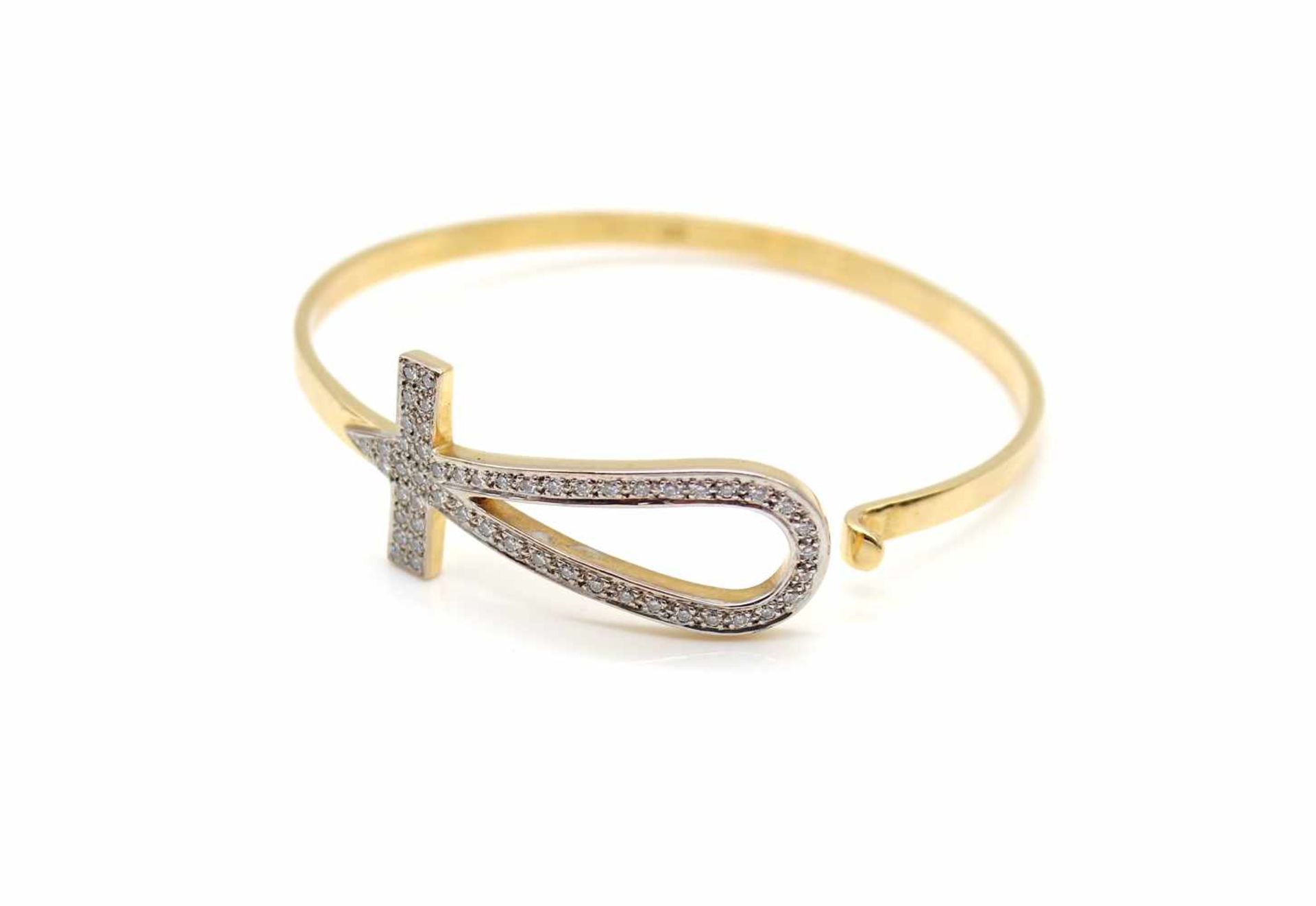 Bangle tested for 750 gold with 52 diamonds, total approx. 0.78 ct in high quality.Weight 25.8 g,