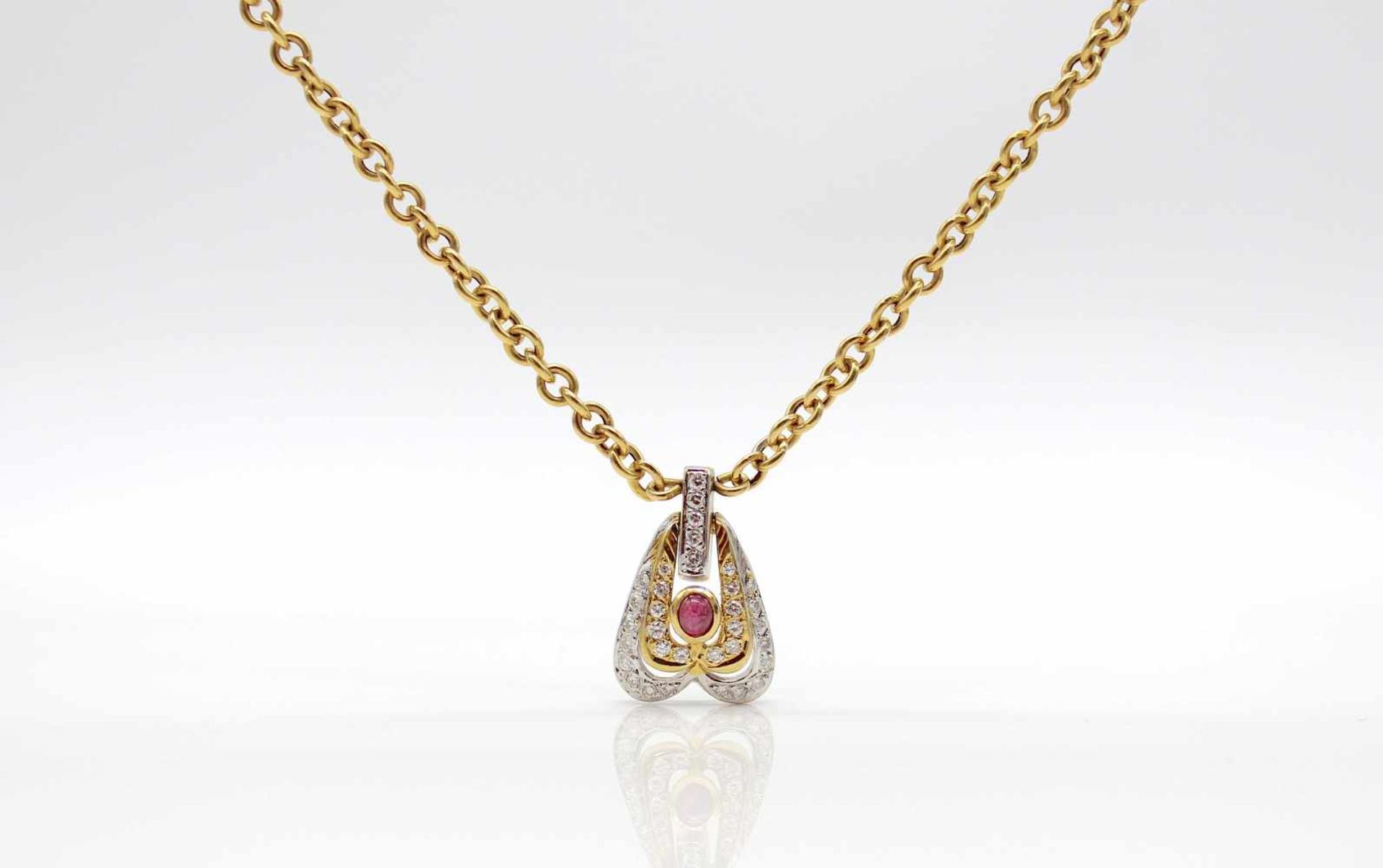 Collier tested to 21.6 ct gold platinized with a ruby and 33 diamonds, total approx. 0.60 ct in high