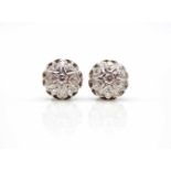 1 pair of earrings tested on 750 white gold with 14 diamonds, total approx. 1.0 ct, high purity