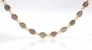 Bracelet made of 585 gold with 11 precious opals.weight 7,3 g, length approx. 18 cm Armband aus