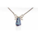 750 white gold necklace with a boulder opal, 21 x 13.5 mm and 16 diamonds, total ca. 0.50 ct.
