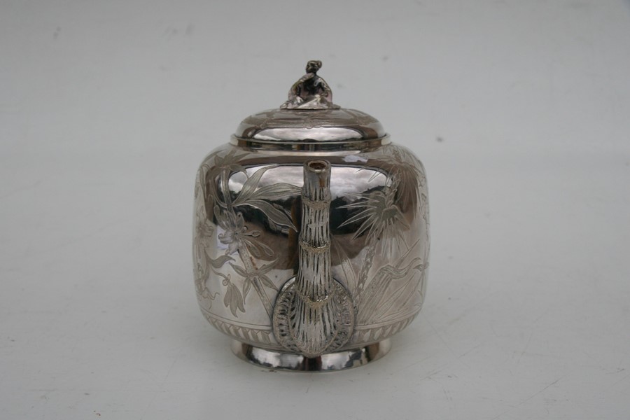 A Victorian silver plated Japanese manner teapot decorated with flowers, fans and insects, 17cms ( - Image 6 of 7