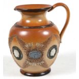 A rare 19th century Doulton Lambeth motto stoneware jug 'Bitter Must Be The Cup That A Smile Will