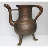 A continental bronze zoomorphic ewer with dragon head spout and paw feet, 28cms (11ins) high.