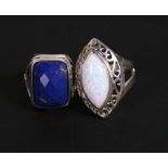 A silver dress ring set with a rectangular lapis lazuli; together with another silver dress ring (