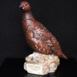 A Royal Doulton Matthew Gloag & Son Famous Grouse whisky decanter modelled as a grouse perched on