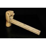 A 19th century Marine ivory and whale bone gavel in the form of a clenched fist, 17cms (6.75ins)