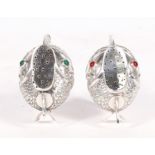 A pair of Spanish silver fish shaped pepper pots, 6cms (2.25ins) high.