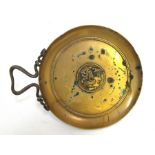 A Grand Tour Roman or Greek bronze dish decorated in relief with the head of Alexander the Great and