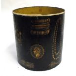 A 1950's Fornasetti lacquered waste paper bin decorated with gilded ships and swags, 27cms (10.5ins)