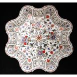 An Indian pietra dura style dish with undulating rim, 42cms (16.5ins) wide.