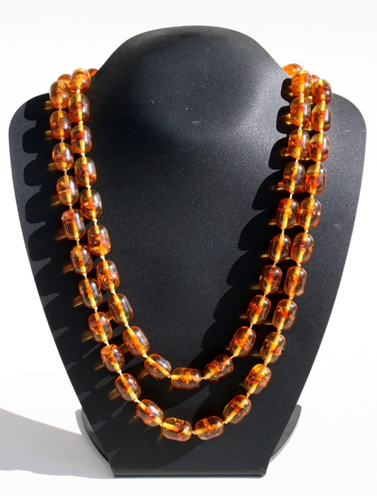 A Baltic amber bead necklace, each bead approx 1.5cms long.