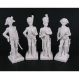 A set of four Naples porcelain figures depicting 19th century military soldiers, 21cms (8.25ins)