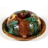 A 19th century majolica muffin dish and cover with impressed lozenge mark to the underside, 20cms (