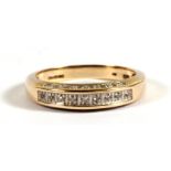 A 9ct gold diamond half-eternity ring, approx UK size 'N'.