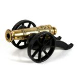 A very heavy Victorian bronze barrelled signal cannon mounted on an iron carriage. Having the