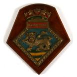 A hand painted bronze ships plaque or crest mounted on a wooden shield to HMS Maidstone. 15.5cms (