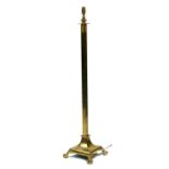 A brass standard lamp with square column standing on ball & claw feet, 132cms (52ins) high.