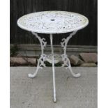 A cast pierced and painted aluminium garden table, 69cms (27ins) diameter.