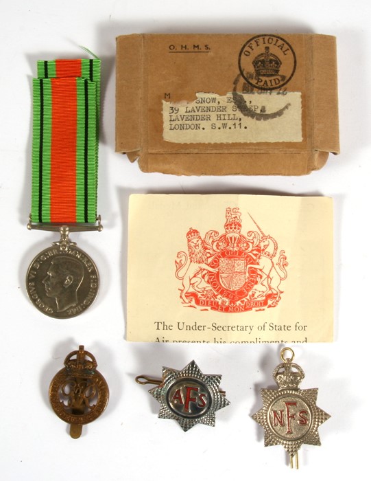 A WW2 Defence Medal with certificate and posting box addressed to Mr Snow of Lavender Hill