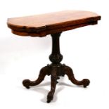 A Victorian burr walnut card table on turned column and quatrefoil legs, 93cms (36.5ins) wide.