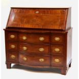 A 19th century continental Biedermeier style two-part bureau, the fall flap enclosing a fitted