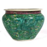 A large Chinese famille verte planter decorated with dragons amongst clouds, 37cms (14.5ins)