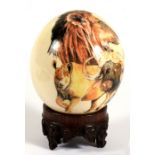 Taxidermy. An African ostrich egg, the painted decoration depicting an elephant, leopard, lion,