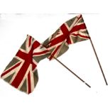 Two early 20th century printed cotton patriotic Union Jack flags on poles. Flag size 36cms (14.