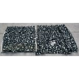 Two matching crewel work curtains decorated with foliage on a black ground, the largest 400cms (