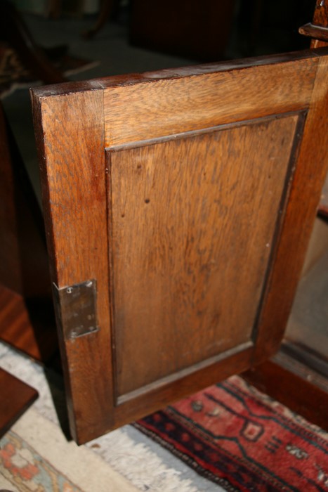 An early 20th century oak twin pedestal partner's desk, the top with green inset leather top, - Image 7 of 11