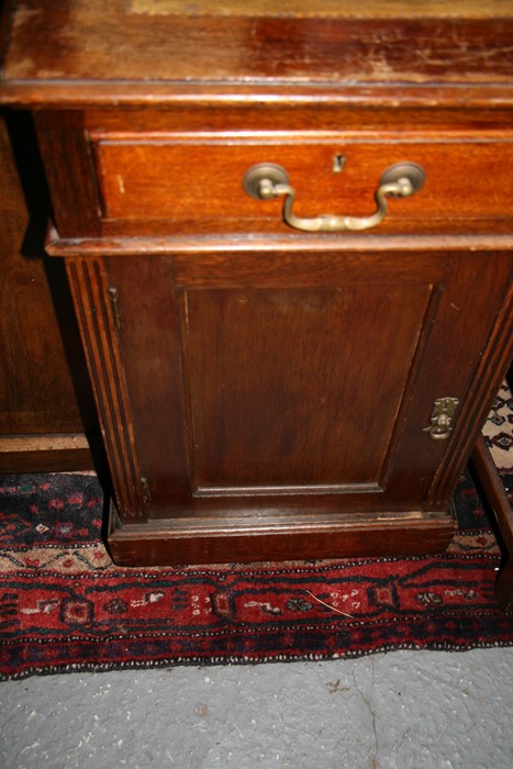 An early 20th century oak twin pedestal partner's desk, the top with green inset leather top, - Image 5 of 11