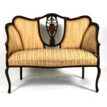 An Edwardian mahogany salon sofa with upholstered seat and back, on cabriole front supports,