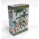 A Chinese famille rose flower brick or pillow decorated with a dragon and a lion, 19.5cms (7.