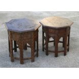 Two Eastern octagonal folding tables inlaid with brass foliate scrolls, 46cms (18ins) wide.