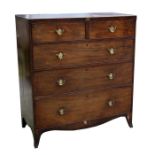 A Regency mahogany chest of two short and three long graduated drawers, on splayed bracket feet,