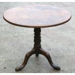 A 19th century circular tilt-top table on turned column and tripod base, 83cms (33.5ins) diameter.